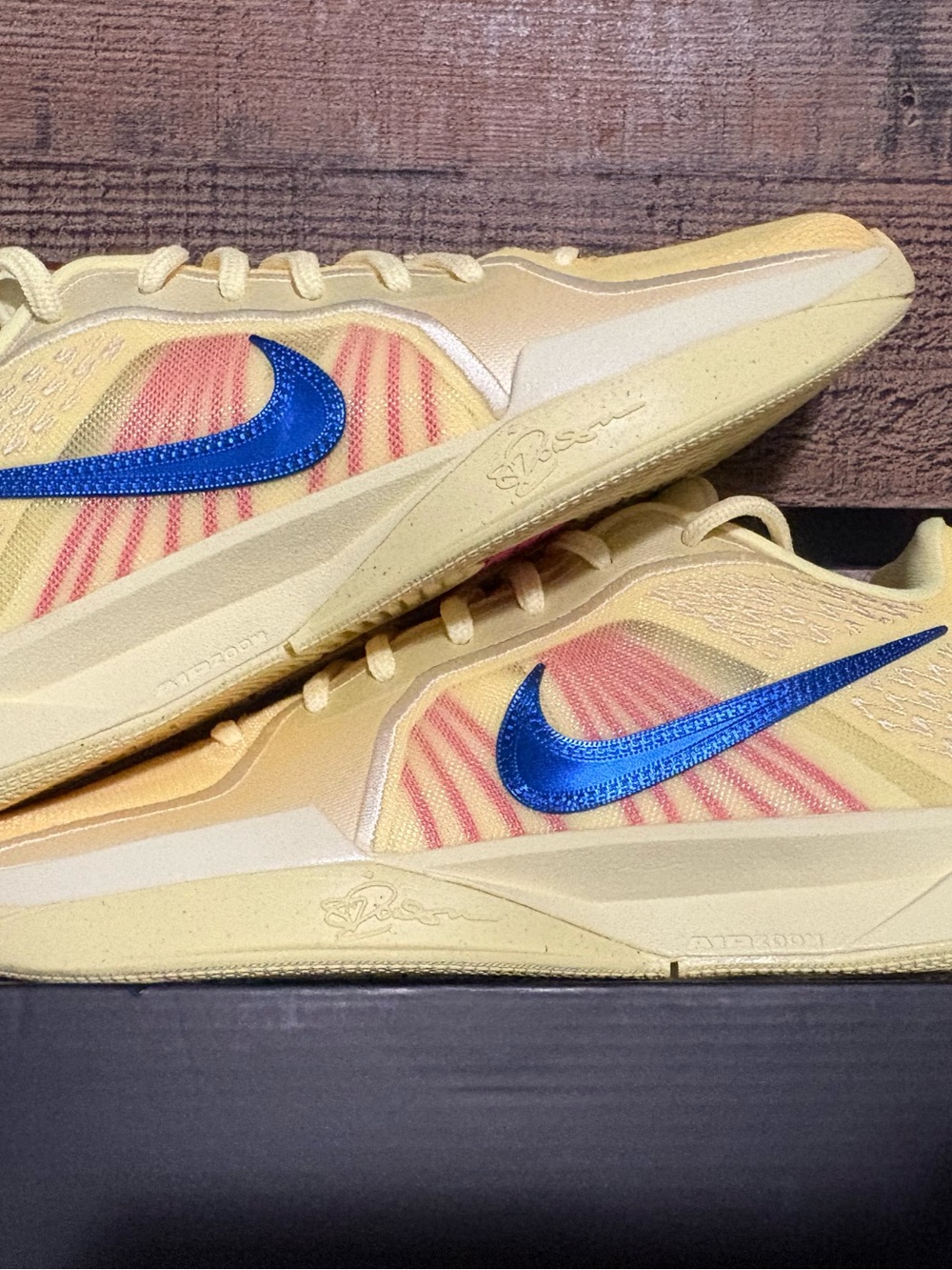 Nike Yellow Running Shoes with Metallic Blue Swoosh and Pink Accents